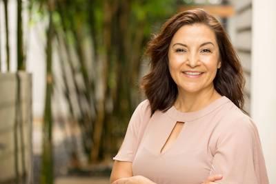 Woman smiling after periodontal treatment