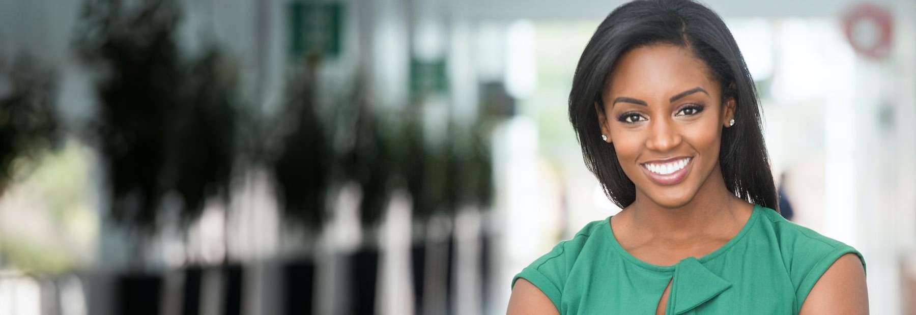 A woman smiling after a visit to the best dentist in St. Augustine, FL