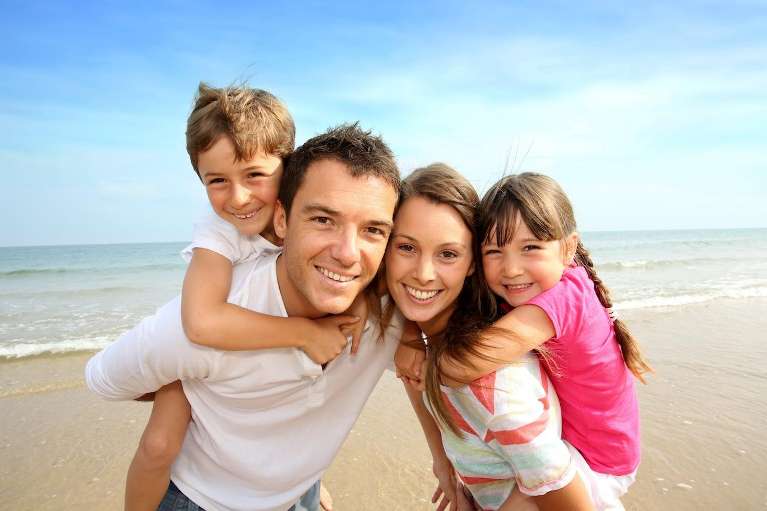 A Family Smiling Together after Dental check up by Best Dentist in St. Augustine, FL