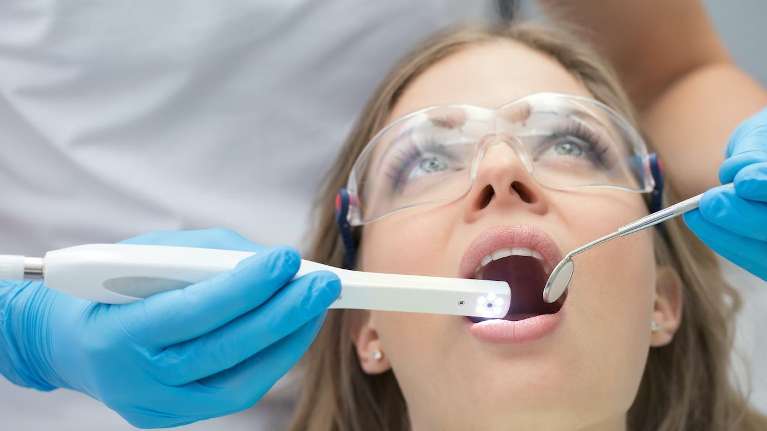 A woman getting a dental exam | dentist St Augustine FL
