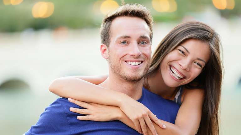 A couple smiling after visiting the best dentist in St. Augustine, FL
