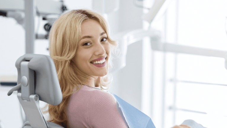 A smiling woman at the dentist | dentist st augustine