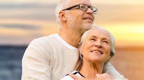 An elderly couple smiling after getting Dentures in St. Augustine, FL