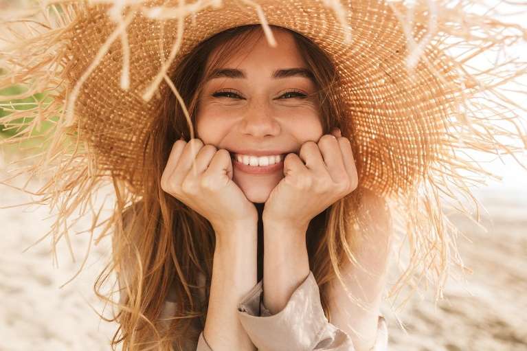 A woman smiling after a cosmetic dentistry in St. Augustine, FL