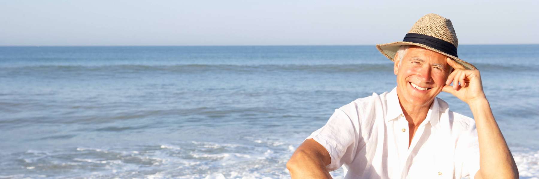 An elderly man smiling after getting Dentures in St. Augustine, FL