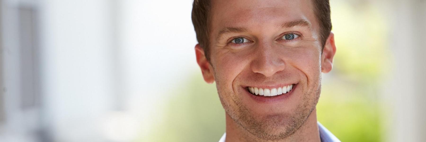 Man smiling after in-office teeth whitening