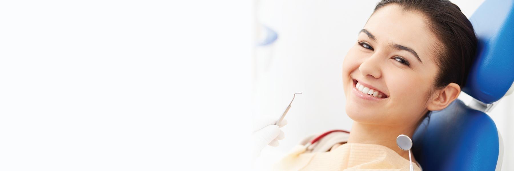 woman smiling in dental chair, st augustine fl